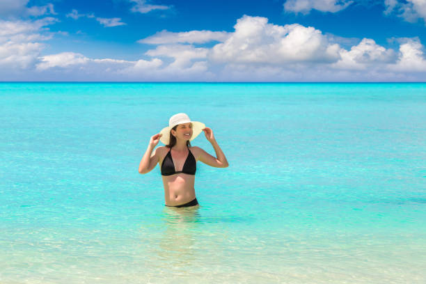 istock Woman at tropical beach 1346450273