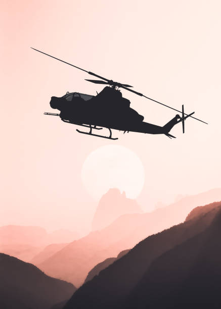 istock American attack helicopter silhouette in the flight 1346450523