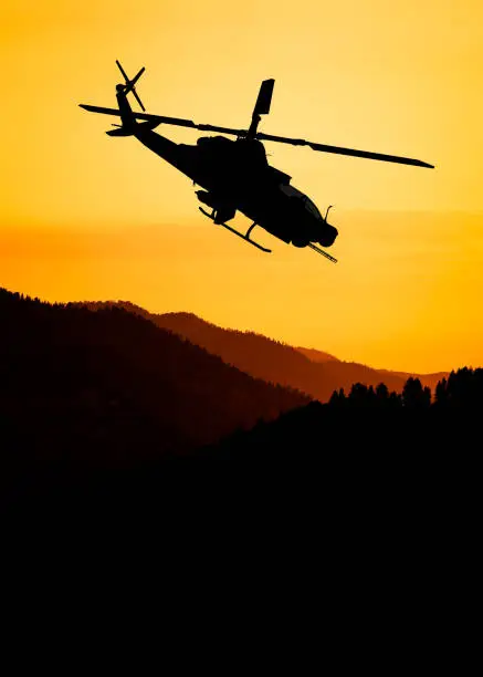 American attack helicopter silhouette in the flight