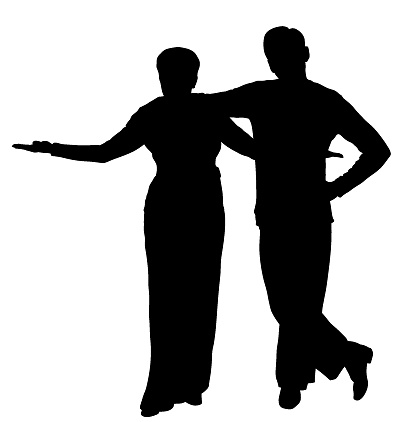 Silhouettes of a couple of posing dancers