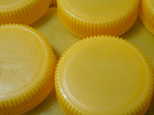 Yellow plastic caps. Recycling concept