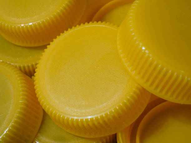 istock Yellow plastic caps. Recycling concept 1346458786