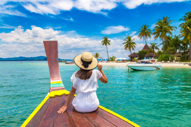 istock Woman on boat in Thailand 1346459632