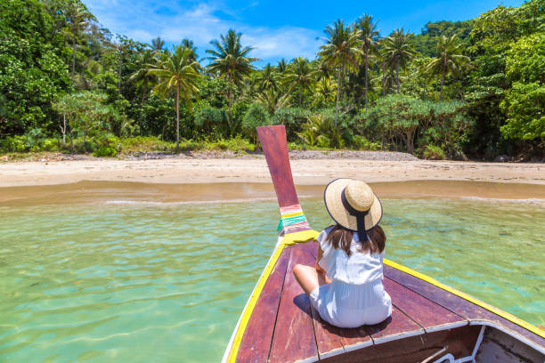 istock Woman on boat in Thailand 1346459651