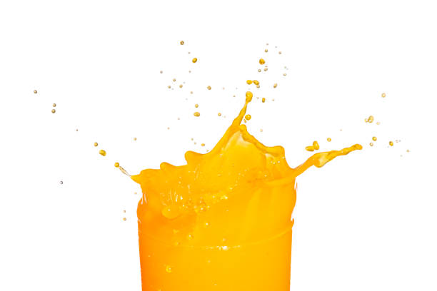istock Orange juice splash isolated on white background. 1346461871