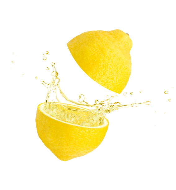 istock Lemon juice splashing  isolated on white 1346461873