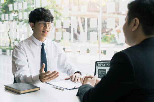 istock The interview room while the staff is preparing the resume document and presenting to the manager who is talking and analyzing about the work experience. 1346462657