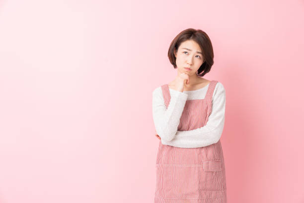 istock attractive asian woman who cooks, think, 1346462813