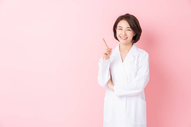 istock attractive asian woman in a white coat 1346462844