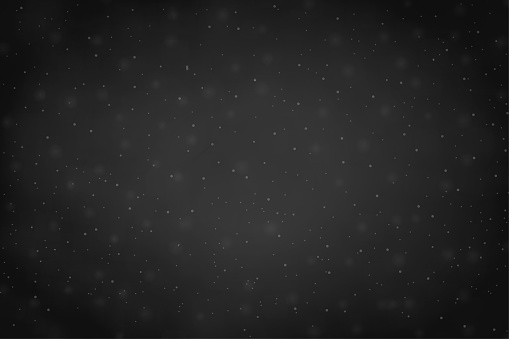 A horizontal vector illustration with spotted textured effect in dark grey with uneven color gradient. Can be used as abstract space related backdrops or cosmic or space related wallpaper. There is copy space, no people and no text. It looks like a galaxy in night with twinkling stars at dots all over.