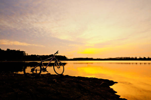 istock Bike at Lake  and light sunset 1346467736