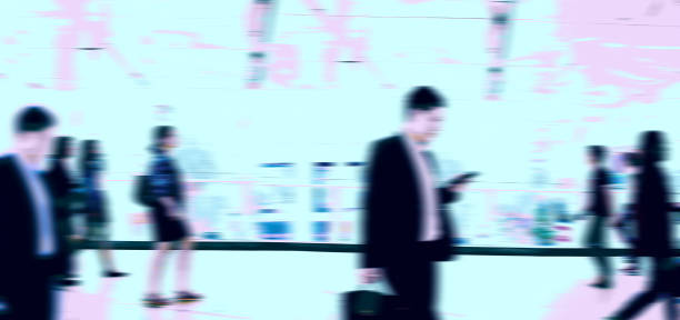 istock blurry peoples walking on Sky-walk way. 1346468938