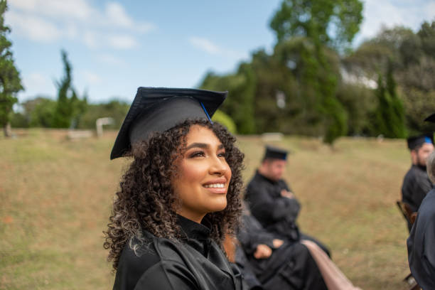 istock Group of graduates at the graduation ceremony. 1346470630