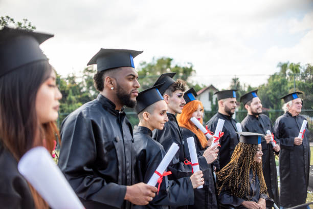 istock Group of graduates on graduation day 1346471474