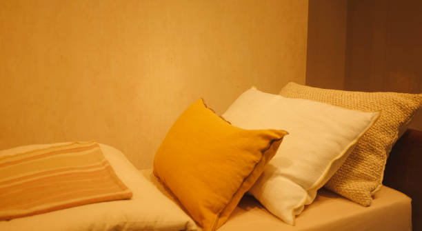 istock Close-up pillow of bedroom with empty bedside table,  modern interior