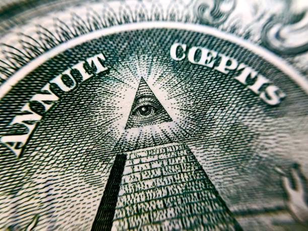 istock American dollar in macro photography. Pyramid with eye 1346473901