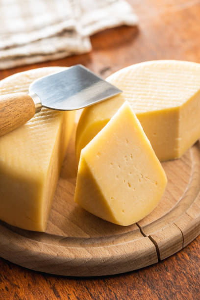 istock Block of hard cheese. 1346476050