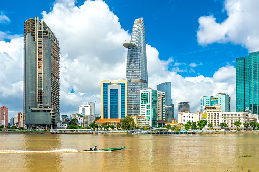 Ho Chi Minh City, Vietnam - October 10th, 2021: Skyscrapers along river with architecture office towers, hotels, center cultural and commercial development country most in Ho Chi Minh city, Vietnam