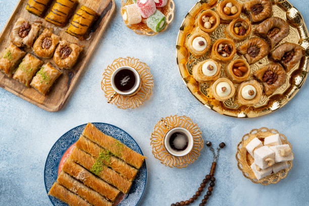 istock Top view of Turkish sweets and turkish coffee on light blue background 1346480416