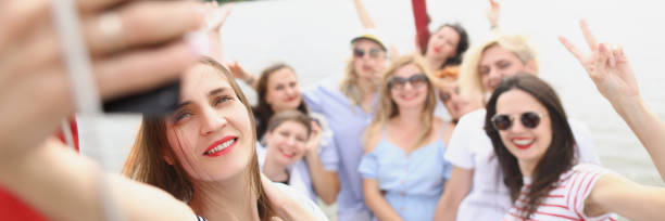 istock Cheerful women on board the boat take a selfie 1346482066