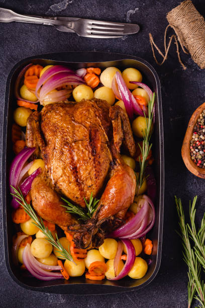 istock Whole baked chicken with vegetables 1346483410