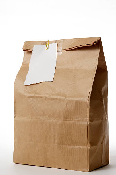 istock Isolated shot of packed lunch with note on white background 134648438