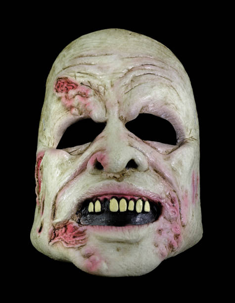 istock Fleshy Zombie Mask Isolated Against Black Background 1346484580