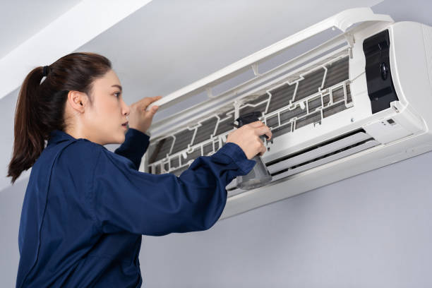 istock female technician service cleaning air conditioner indoors 1346484727