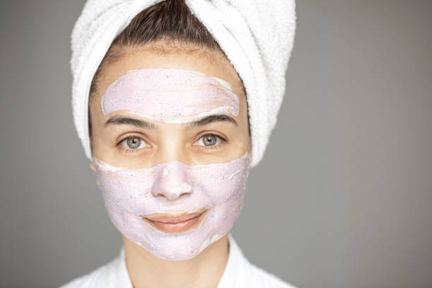 istock Young Woman with Blueberry Mask 1346484816