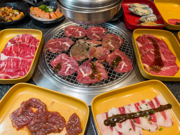 istock meat and pork grilled on charcoal in restaurant 1346485701