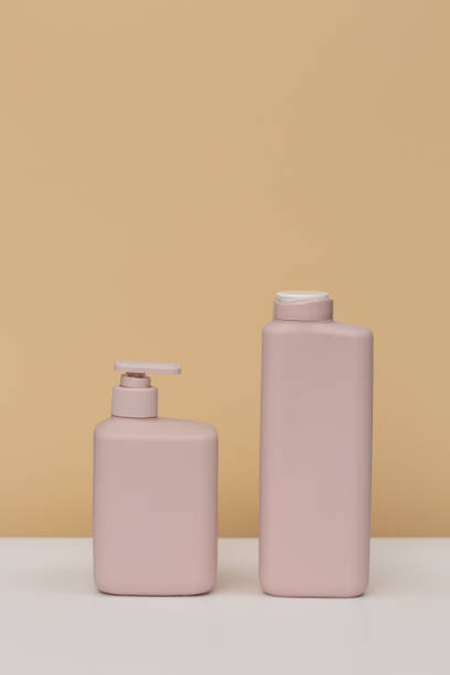 istock two pale pink jars on a beige background 1346487687