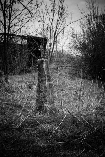 istock Old cross in graveyard. Black and white tone 1346493966