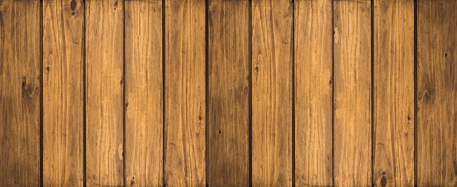 Wooden texture for background or mockup. Fence texture or flat wood banner, billboard, signboard. Brown weathered wood texture background. Selective focus.