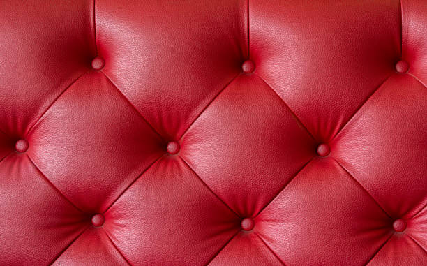 istock Close up part of red sofa for full frame background. 1346494458