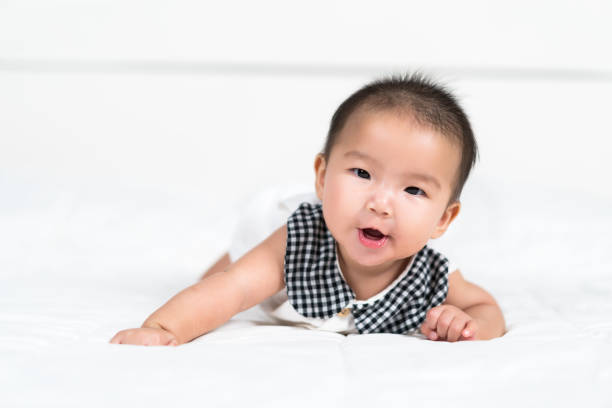 istock happy baby newborn on bed 1346494496