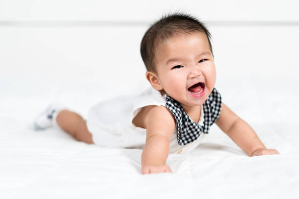 istock happy baby newborn on bed 1346494504