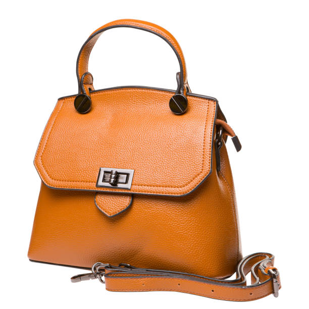istock rich orange leather ladies bag, with a handle and a strap, on a white background 1346494578
