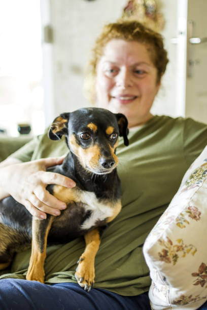 istock Women resting with her dog 1346495455