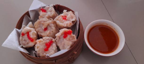 istock Xiumay dimsum with spicy sauce 1346495644