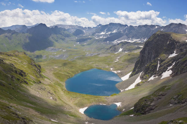 istock blue lake in a mountain valley 1346496457