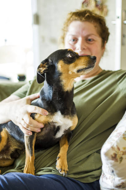 istock Women resting with her dog 1346496546