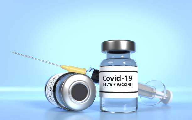 istock Covid-19 Coronavirus Delta Variant Vaccine with Syringe Against Blue Background 1346498629