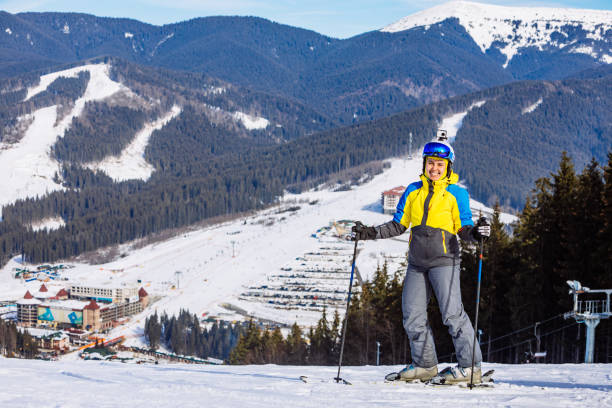 woman in ski equipment on the top of the hill woman in ski equipment on the top of the hill. lifestyle bukovel ski resort ukraine stock pictures, royalty-free photos & images