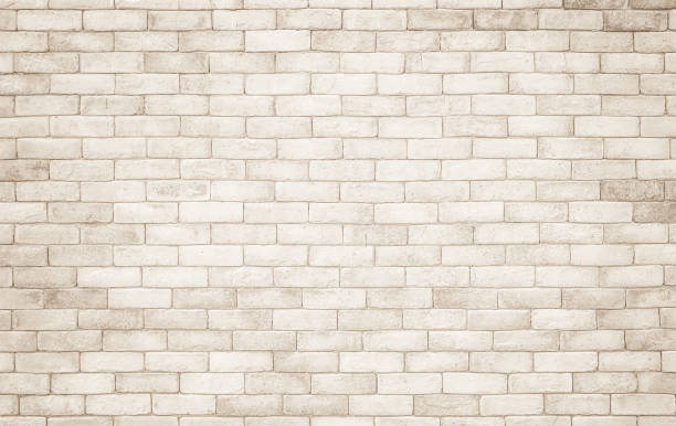 cream and white brick wall texture background. brickwork and stonework flooring interior rock old pattern clean concrete grid uneven bricks design stack. background of old vintage brick wall - cast in stone imagens e fotografias de stock