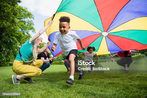 istock School Children with a Parachute 1346503960