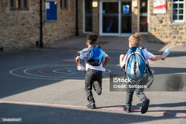Running To School Stock Photo - Download Image Now - Elementary Student, Child, Schoolyard