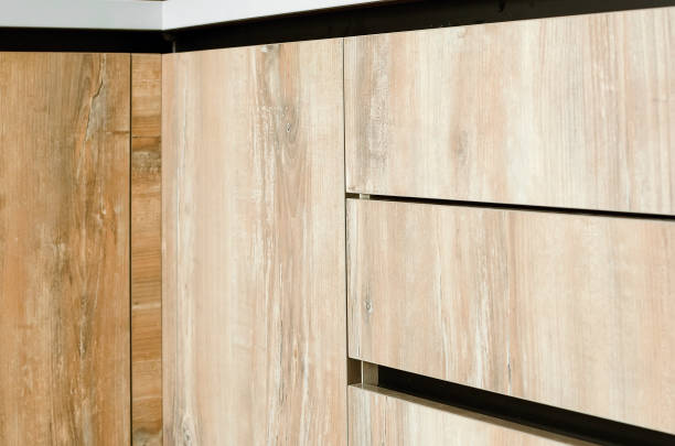 istock Fragment of a plastic kitchen facade with wood texture. 1346512132