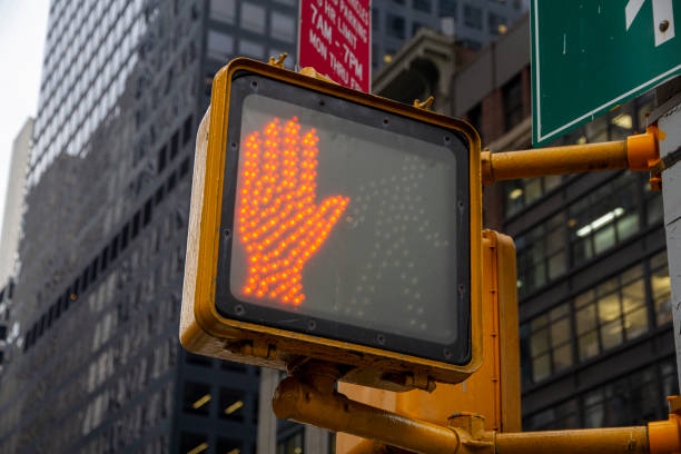 istock Don't walk New York traffic sign with illuminated and blurred background 1346516404