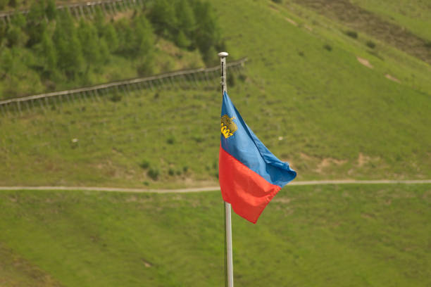 istock Liechtenstein flag is waving in the wind 1346517331