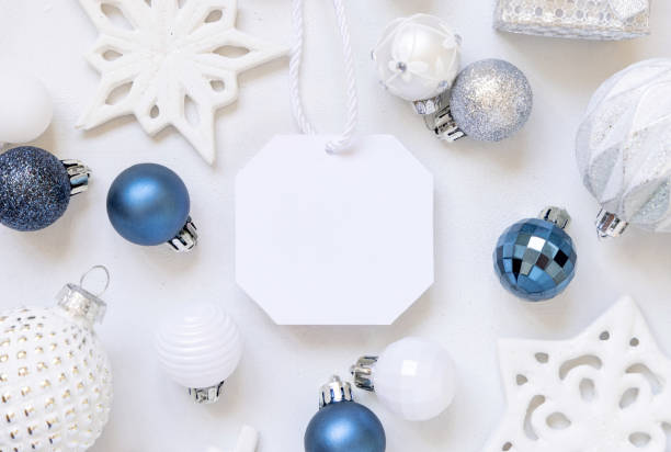 istock Blank gift tag with Christmas decorations around top view, Mockup 1346519091